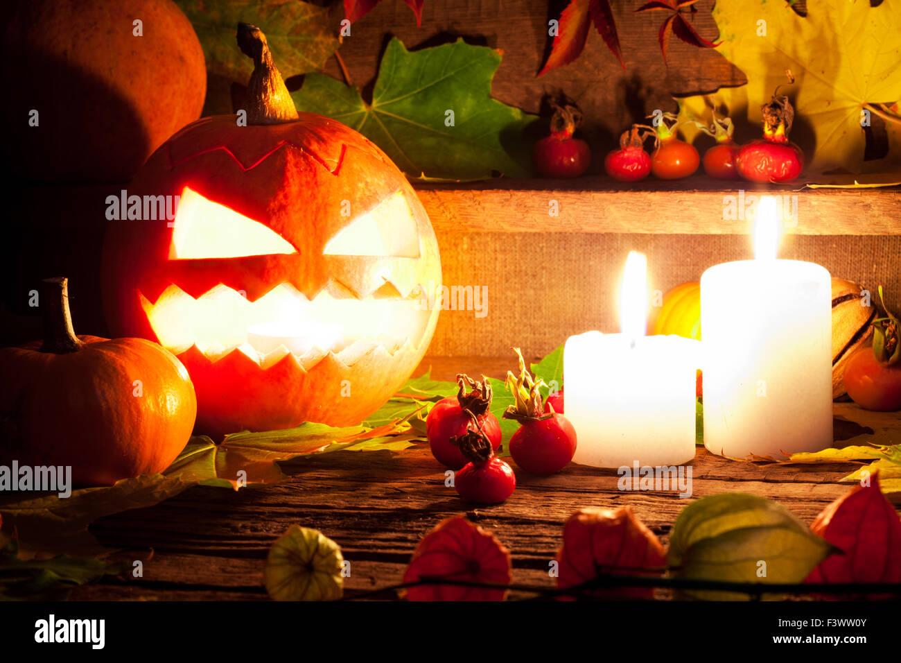 Halloween pumpkins on wooden table background Stock Photo - Alamy