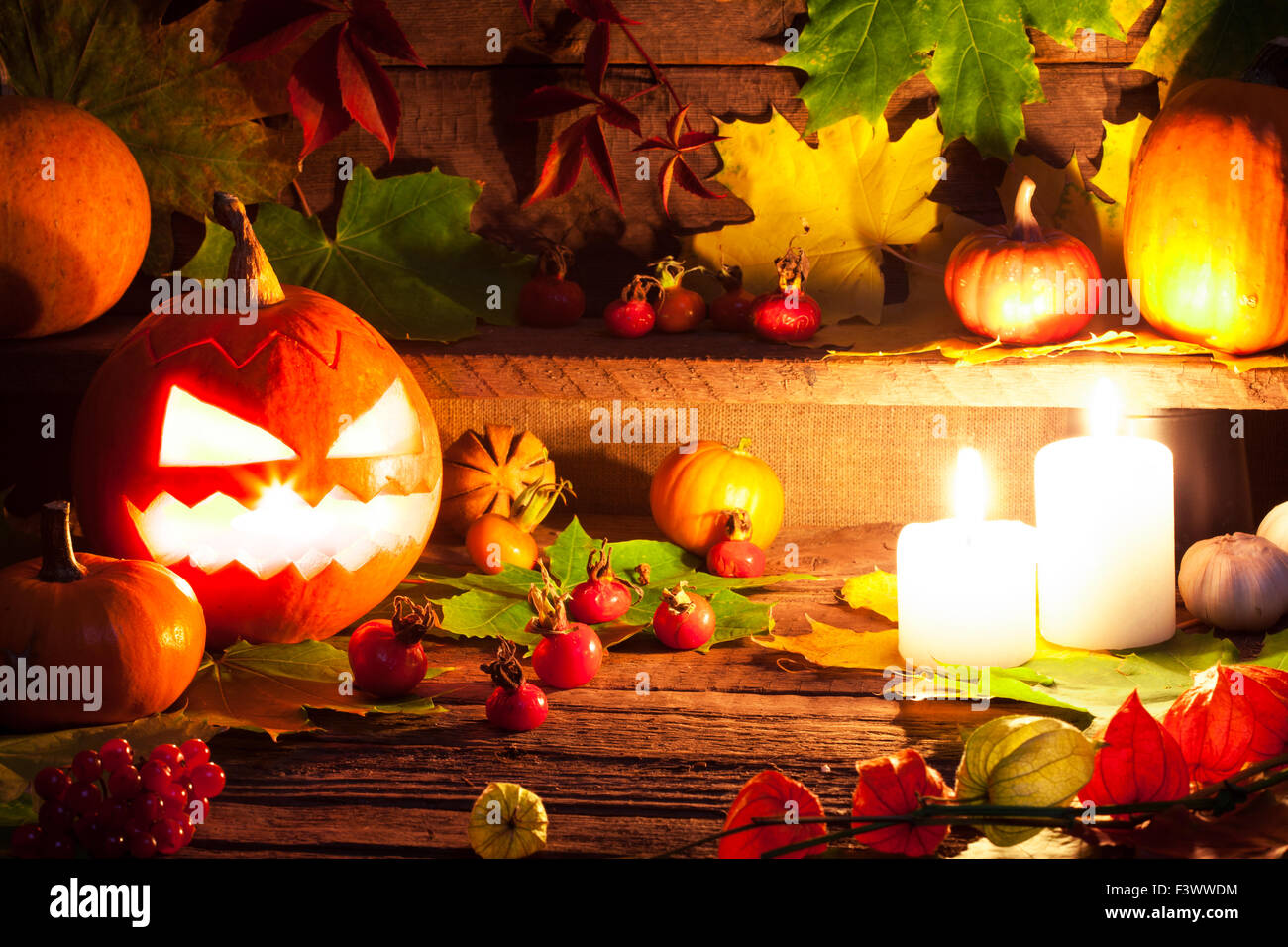 Halloween pumpkins on wooden table background Stock Photo - Alamy