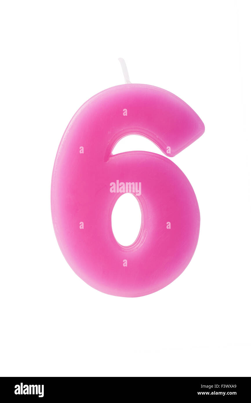 Pink birthday candle in the form of the number six on white background Stock Photo