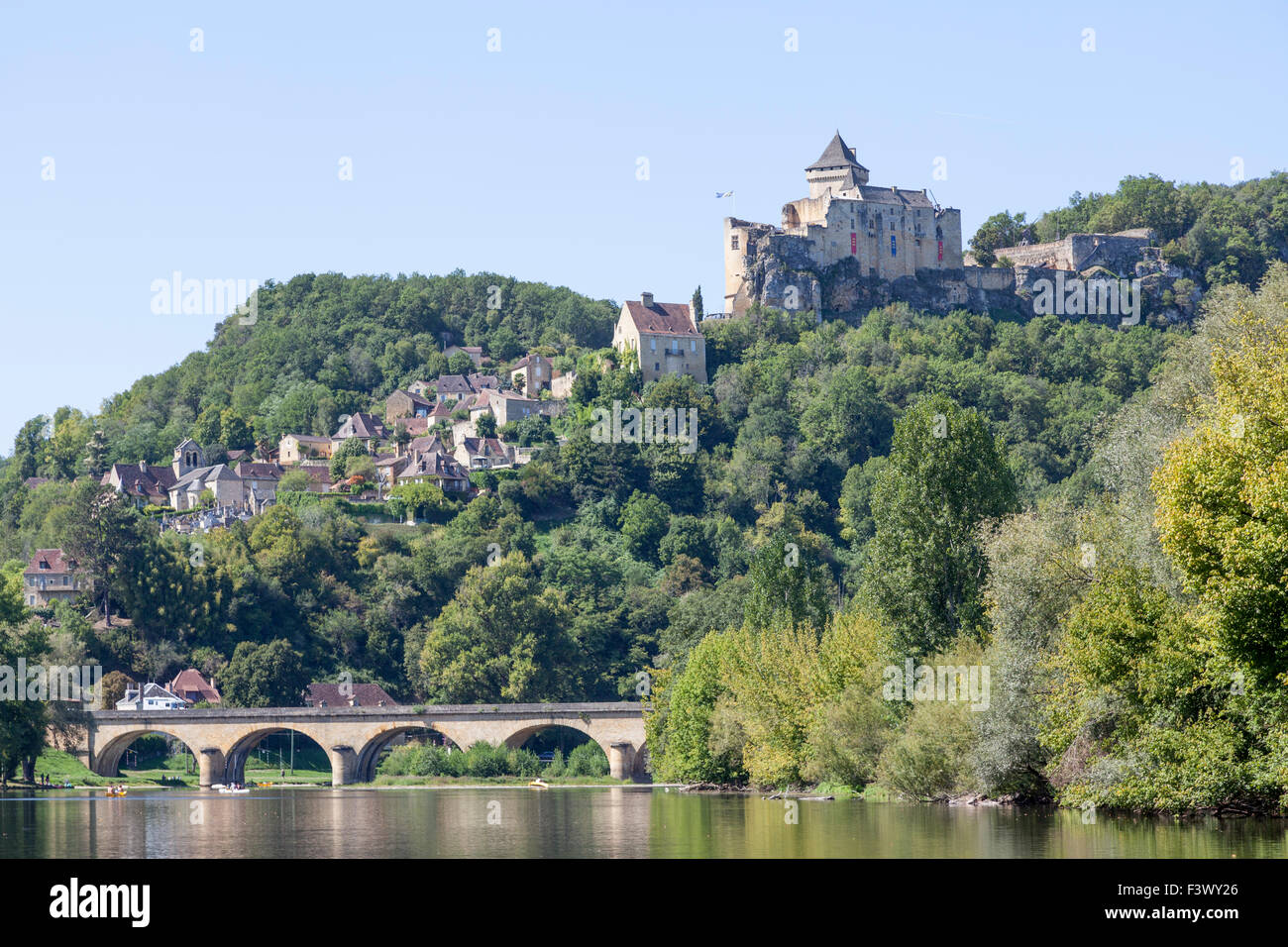 The Castelnaud village with its castle overhanging the Dordogne river (France). Castelnaud la Chapelle et son château (France). Stock Photo