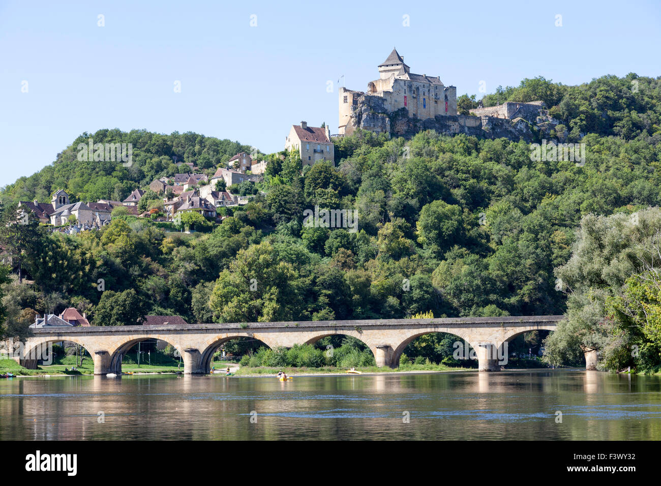 The Castelnaud village with its castle overhanging the Dordogne river (France). Castelnaud la Chapelle et son château (France). Stock Photo