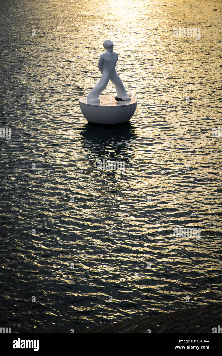floating statue stargazer by sculptor Robert Llimosin Port Vell in