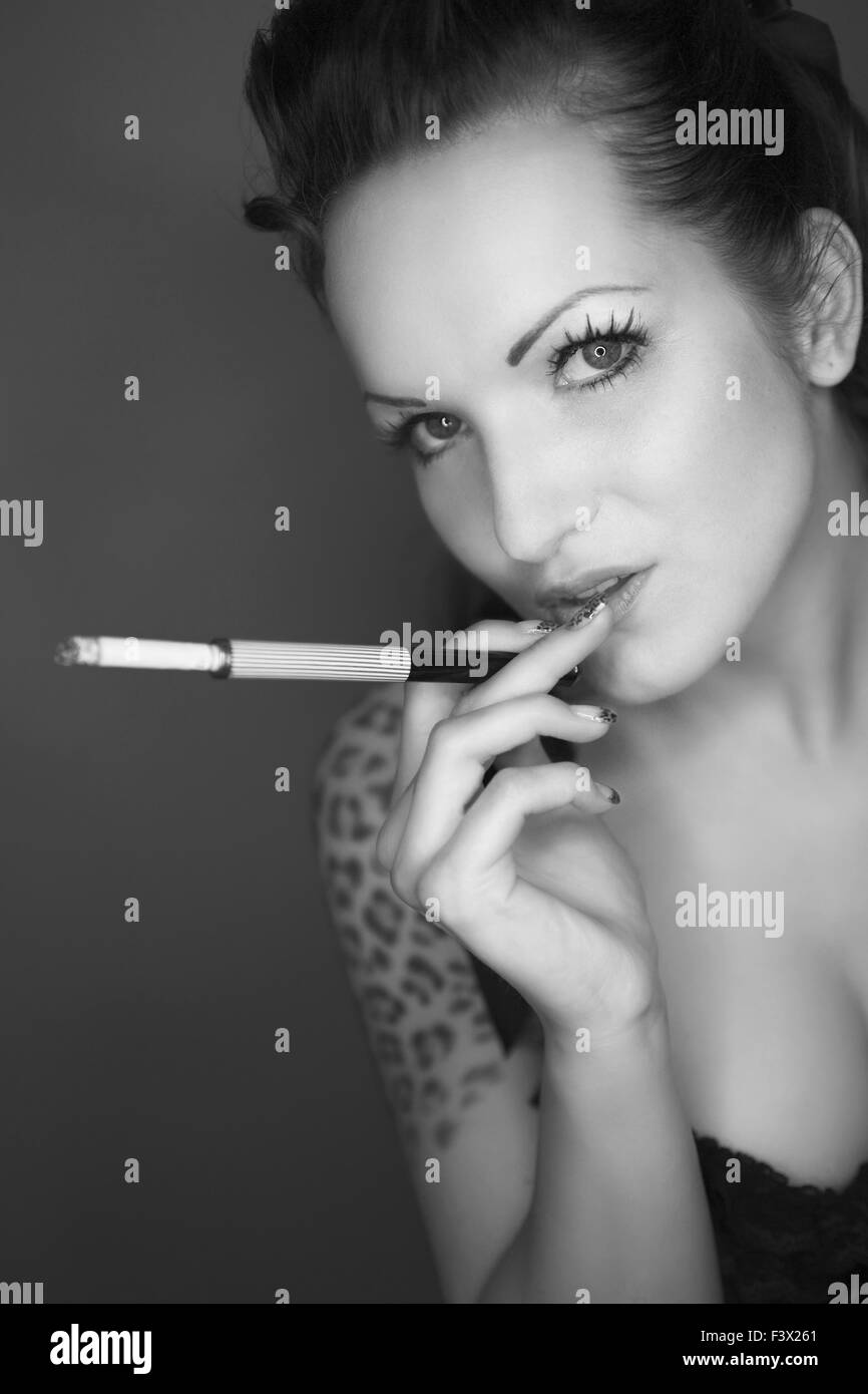 Pin Up Model with cigarette Stock Photo