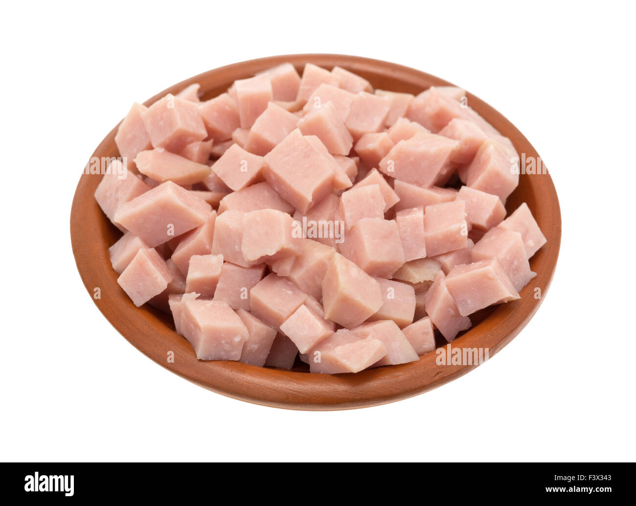A portion of diced ham in a small clay bowl isolated on a white