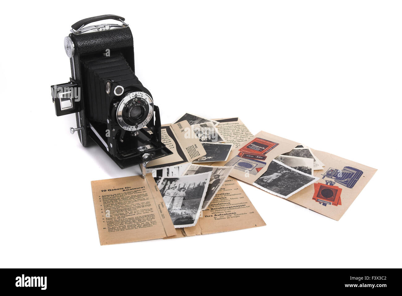 Nostalgic Photographs and roll film camera Stock Photo