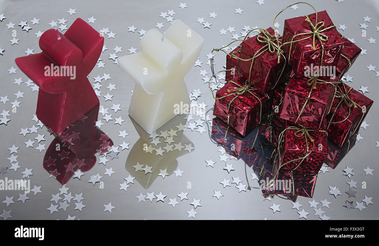 Christmas packages and candles Stock Photo