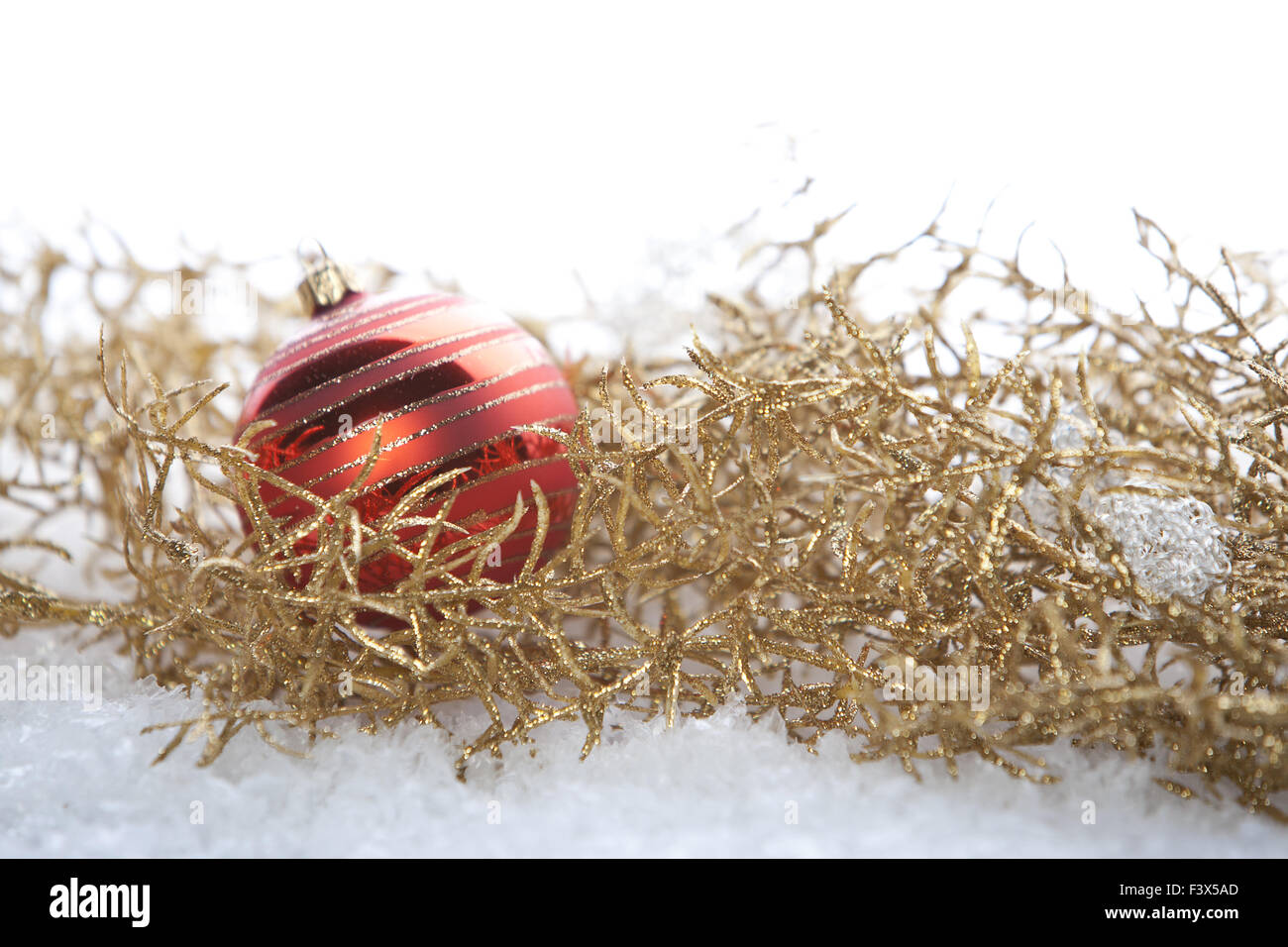 Golden Christmas decoration with snow Stock Photo