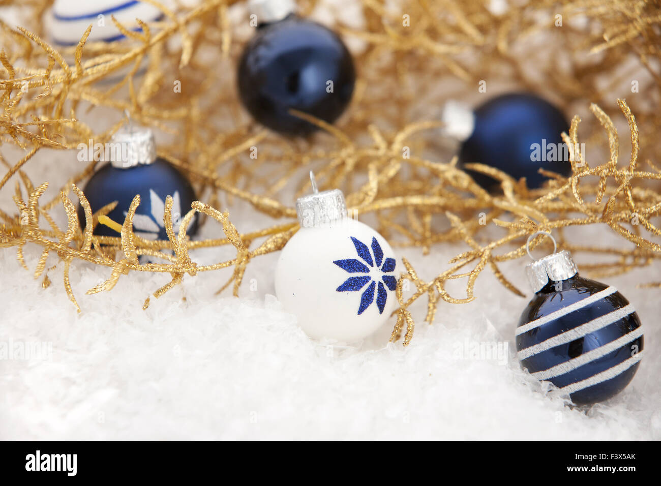 Golden Christmas decoration with snow Stock Photo