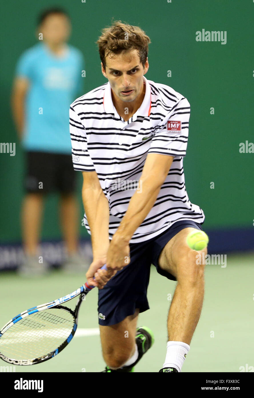 Shanghai, China. 13th Oct, 2015. Albert Ramos-Vinolas of Spain hits a return to Roger Federer of Switzerland during the men's singles second round match at Shanghai Masters tennis tournament in Shanghai, China, Oct. 13, 2015. Albert Ramos-Vinolas won 2-1. Credit:  Fan Jun/Xinhua/Alamy Live News Stock Photo