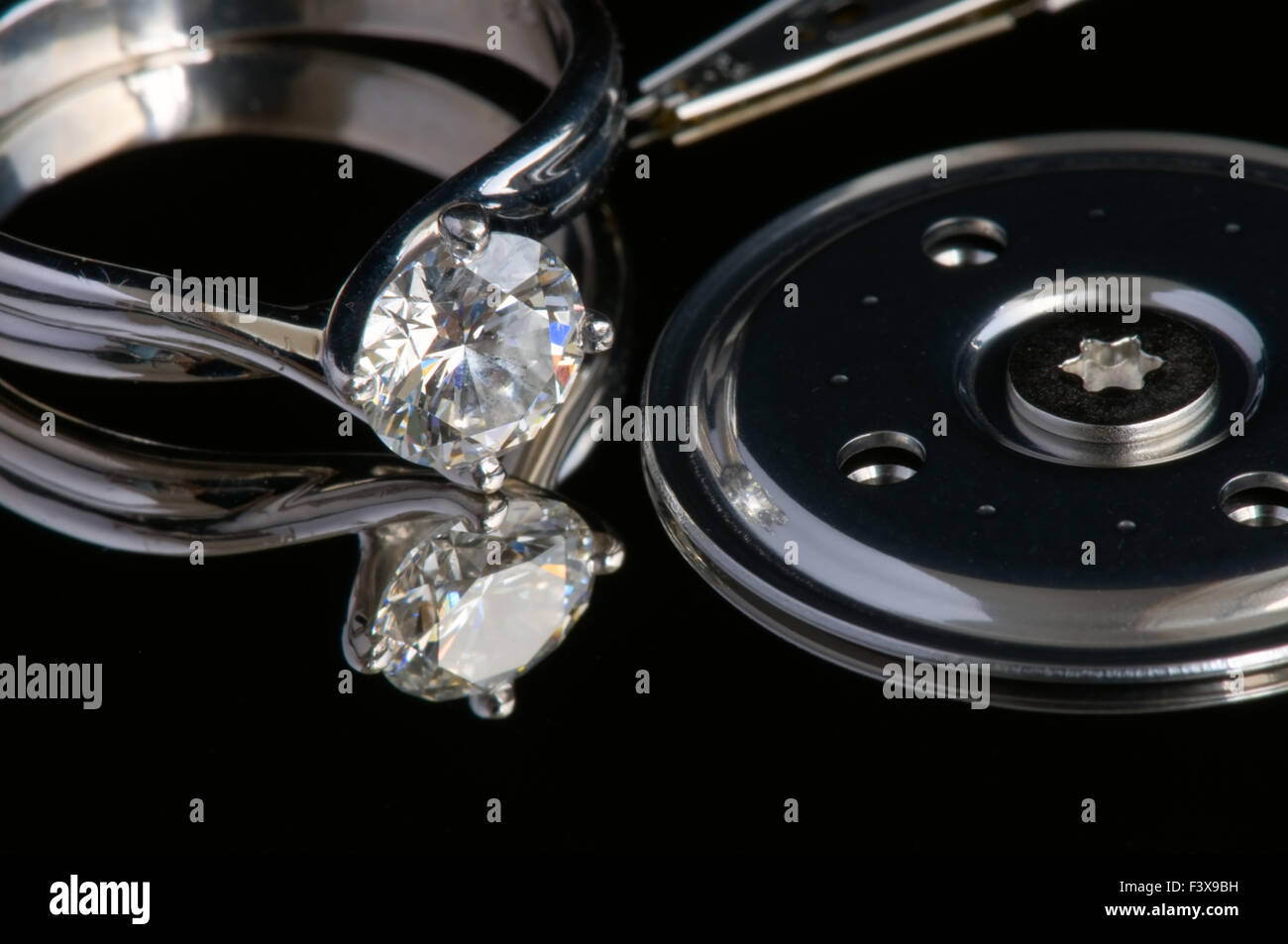 Diamond ring on surface of computer harddisk Stock Photo Alamy