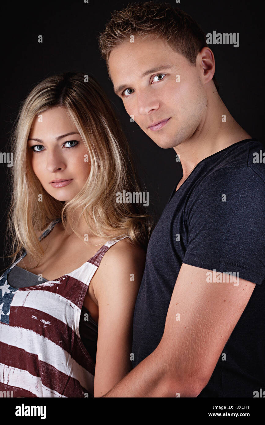 Happy couple on black background Stock Photo