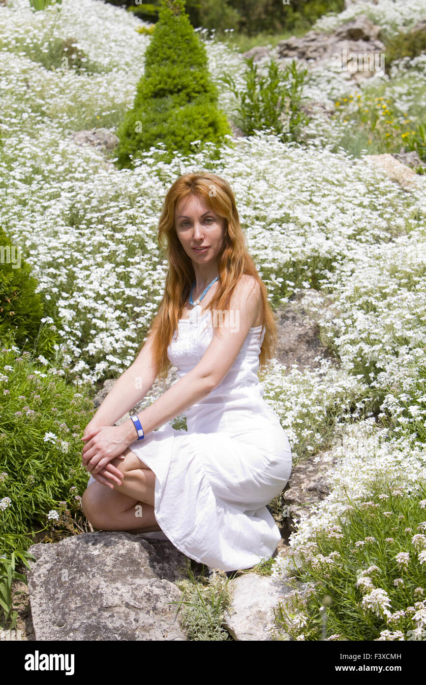 woman among white flowers Stock Photo