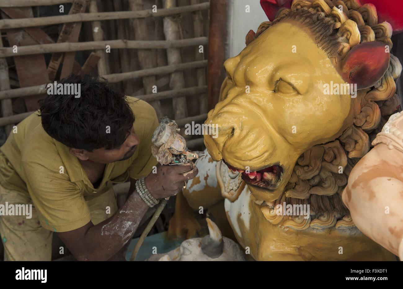 Kolkata. 13th Oct, 2015. An Indian artist paints a clay statue in preparation for the upcoming Durga Puju festival at Kumartuly in Kolkata, Oct. 13, 2015. Durga Puja, the largest Hindu festival, involves worship of Goddess Durga who symbolizes power and the triumph of good over evil in Hindu mythology. © Tumpa Mondal/Xinhua/Alamy Live News Stock Photo