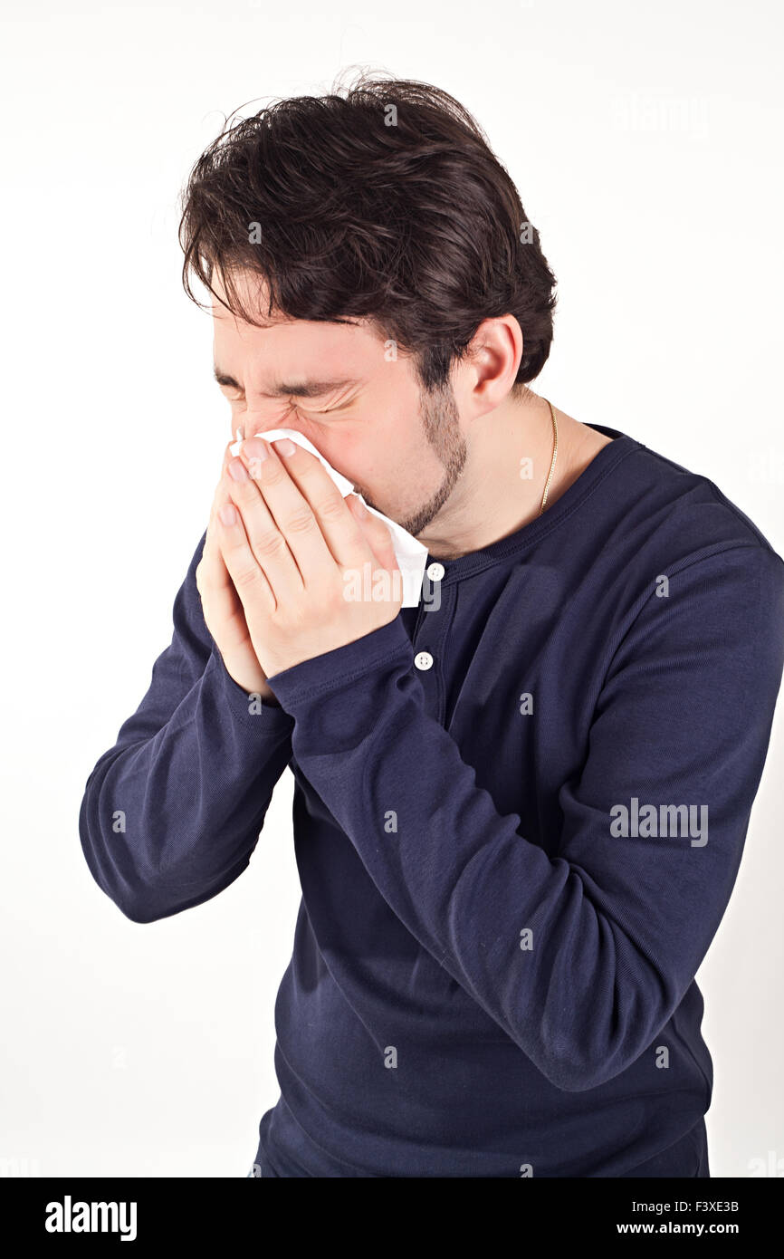 Man with cold holding tissue Stock Photo