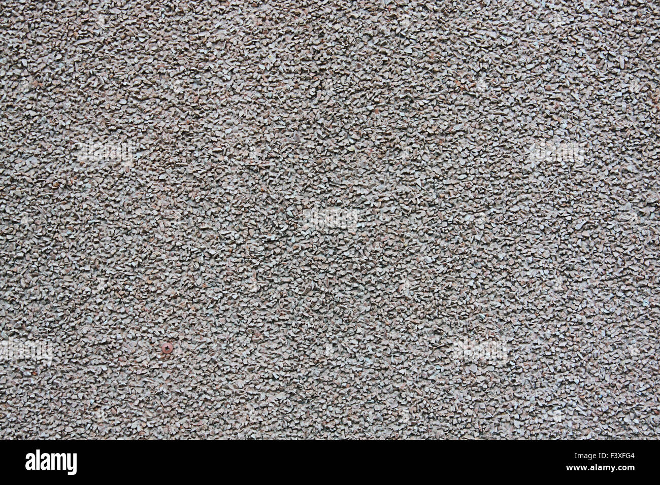 Gray wall with fine gravel Stock Photo
