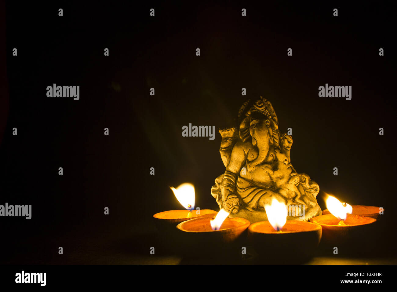 lord ganesh in lamp light Stock Photo