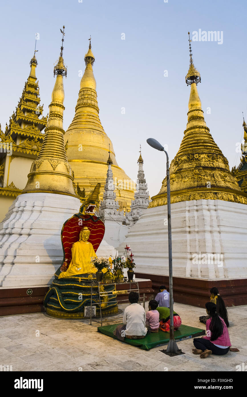 Praying people at Shwedagon Pagoda, Rangun Stock Photo