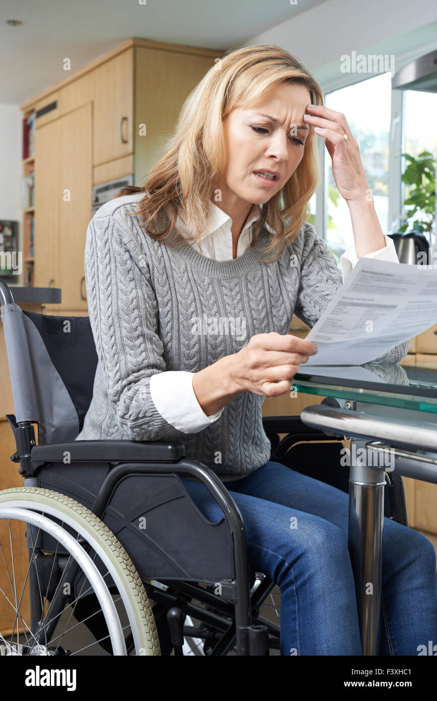 Sad woman in wheelchair hi-res stock photography and images - Alamy