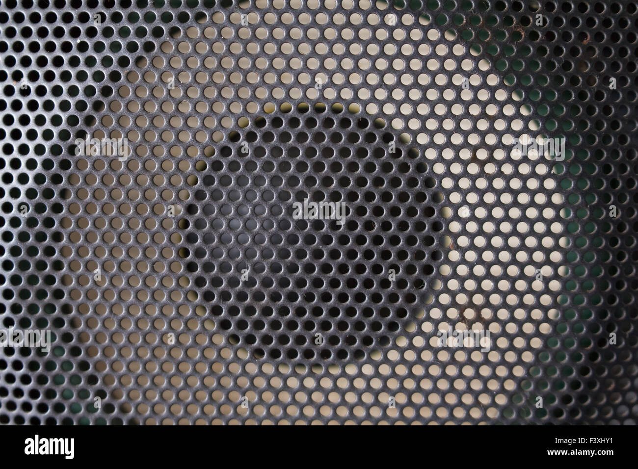 Background consisting of a grid and an audio speaker Stock Photo