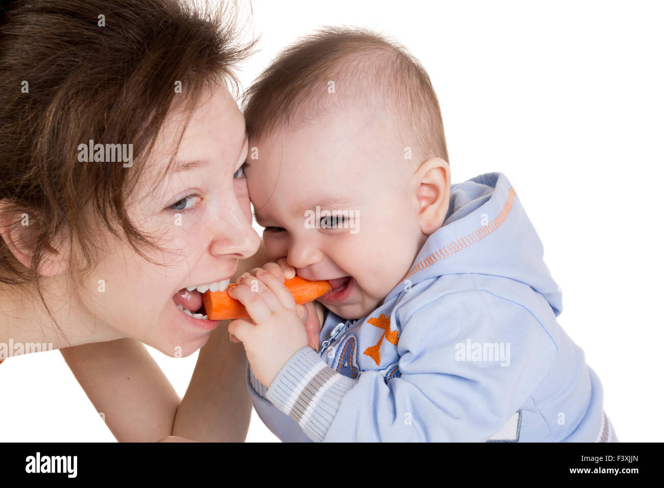 Mother fight with her child for the carrot Stock Photo - Alamy
