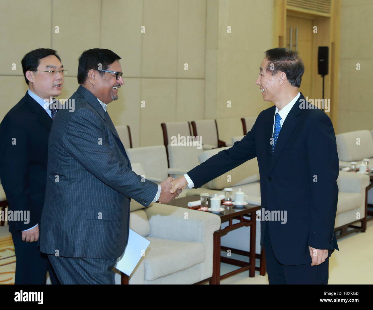 Beijing, China. 13th Oct, 2015. Wang Jiarui (R), vice chairman of the National Committee of the Chinese People's Political Consultative Conference and head of the International Department of the Communist Party of China (CPC) Central Committee, meets with Showkutally Soodhun, president of the Militant Socialist Movement (MSM) of Mauritius, in Beijing, capital of China, Oct. 13, 2015. © Ding Haitao/Xinhua/Alamy Live News Stock Photo