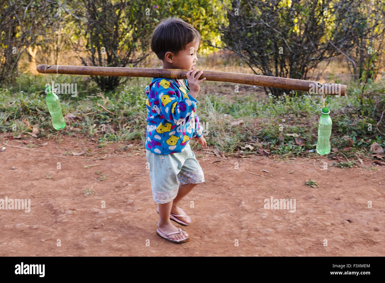 Boy fetching water, Kalaw, Myanmar, Asia Stock Photo