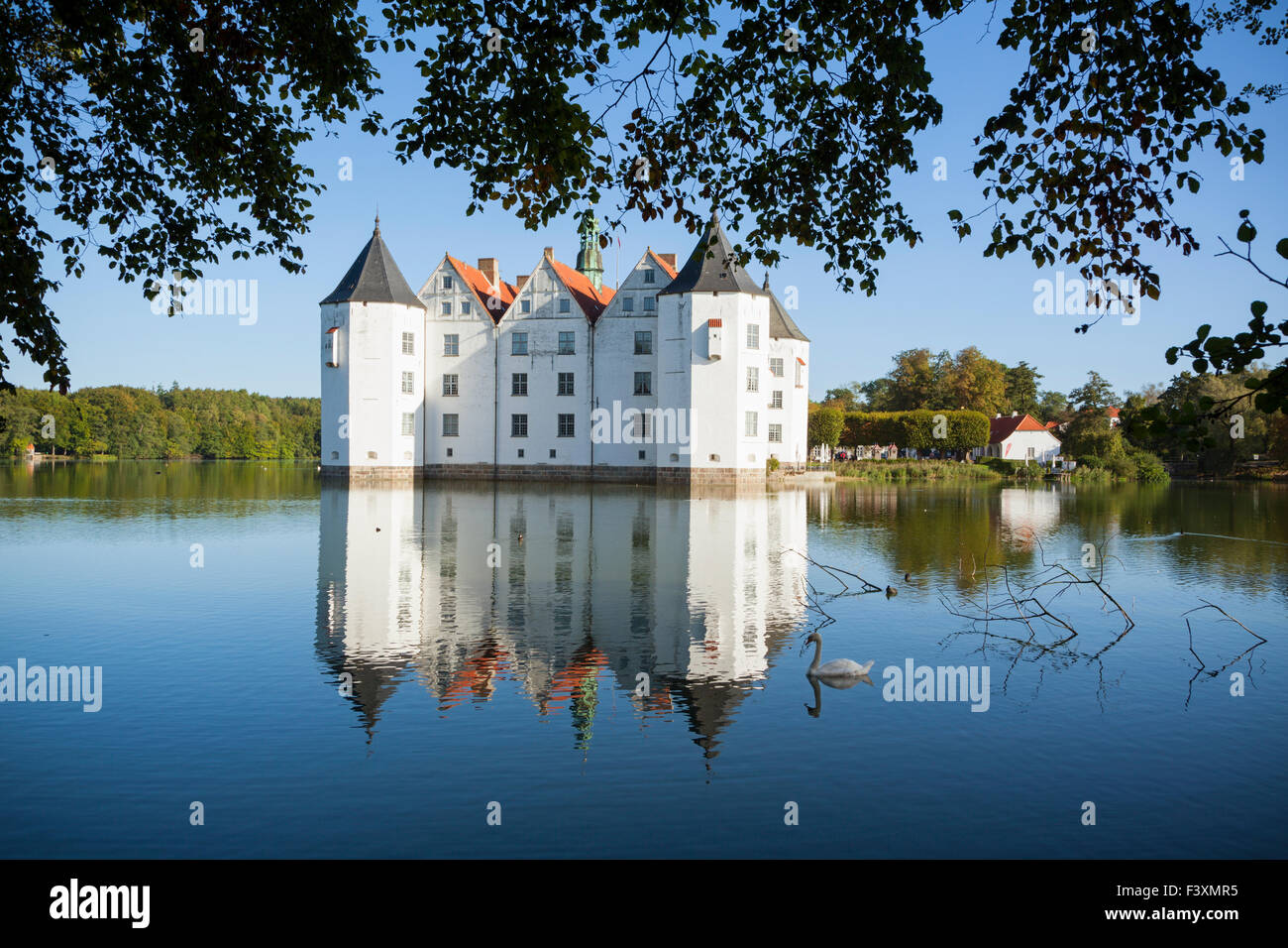 Glücksburg Water Castle with swan on lake Stock Photo
