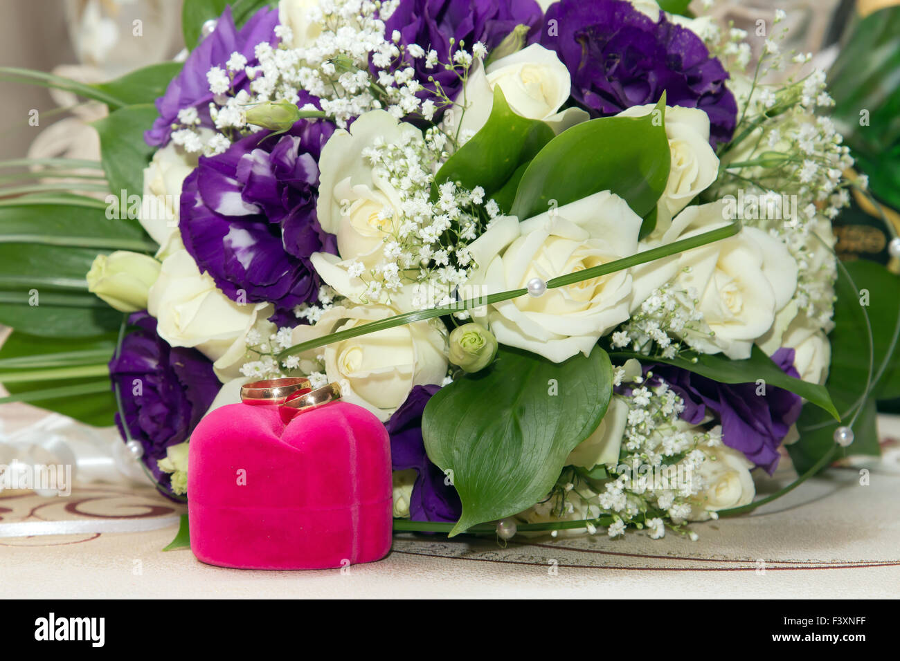 Wedding rings and flowers Stock Photo