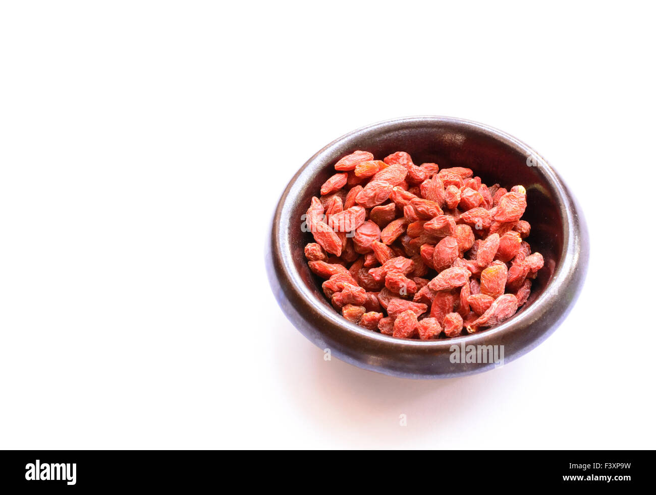 Goji Berries in bowl Stock Photo