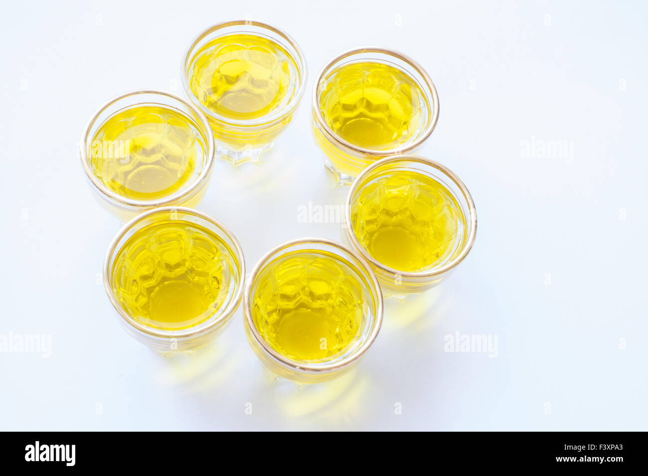 Olive oil shot glasses in a circle Stock Photo Alamy
