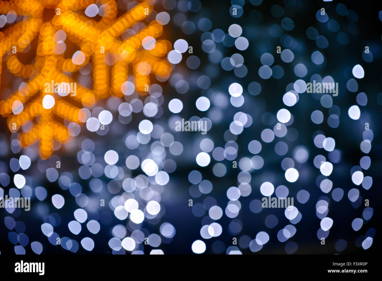 Blurred snowflake and lights background Stock Photo