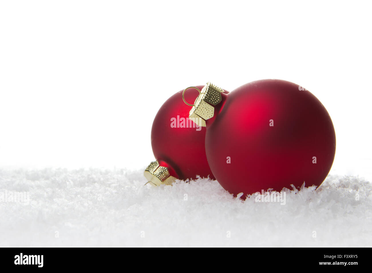 red christmas balls on artificial snow Stock Photo