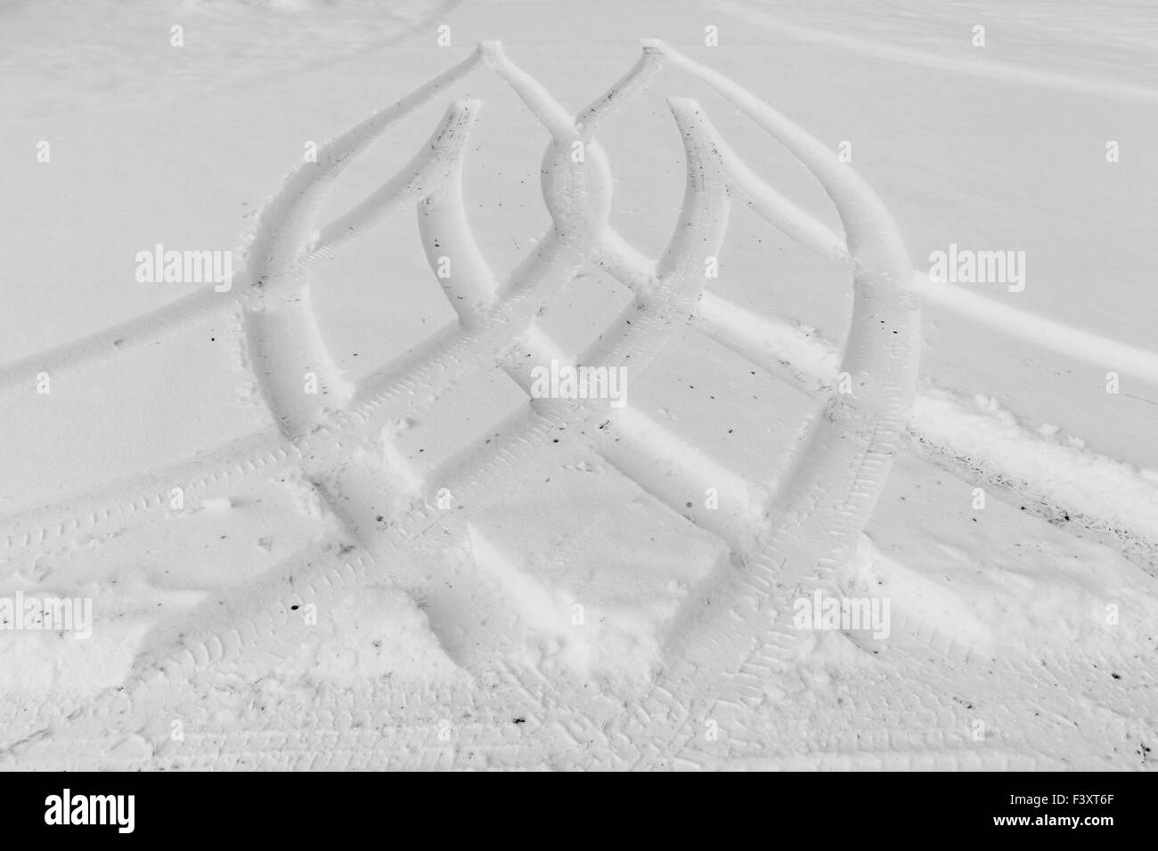 Traces from wheels of the car on snow Stock Photo - Alamy