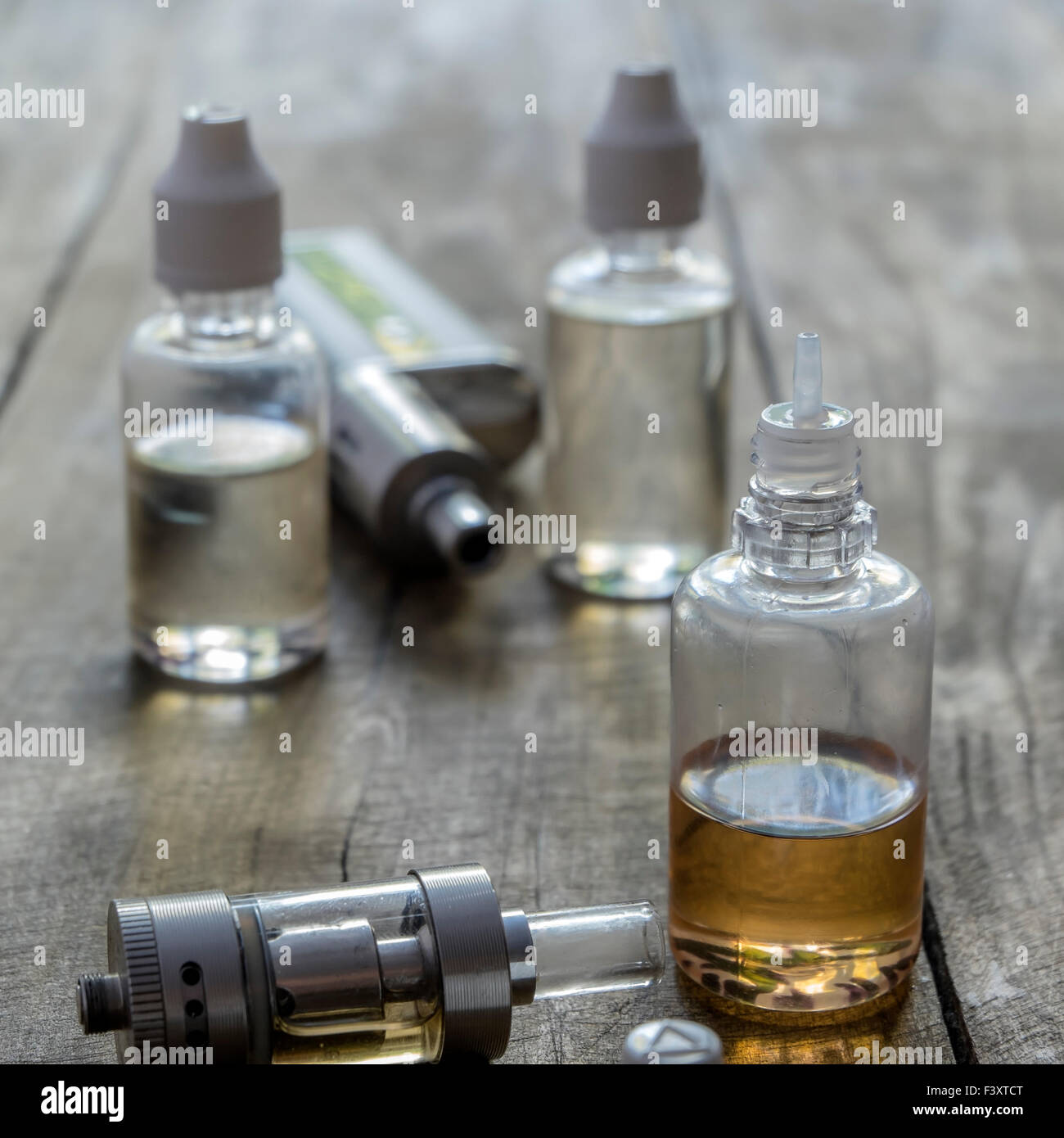 e-cigarettes with different re-fill bottles, close up Stock Photo