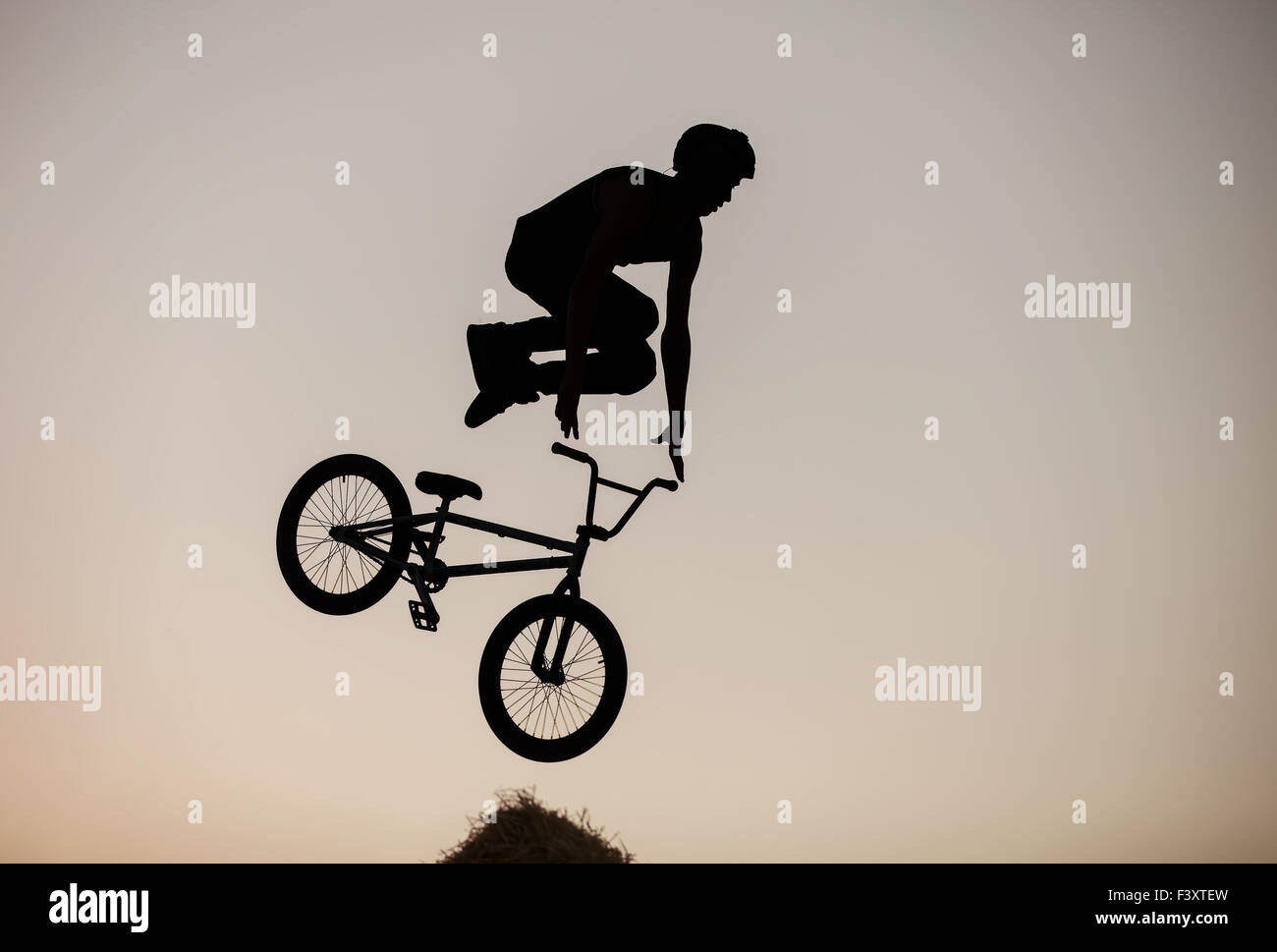 Extreme rider making a bike jump Stock Photo - Alamy
