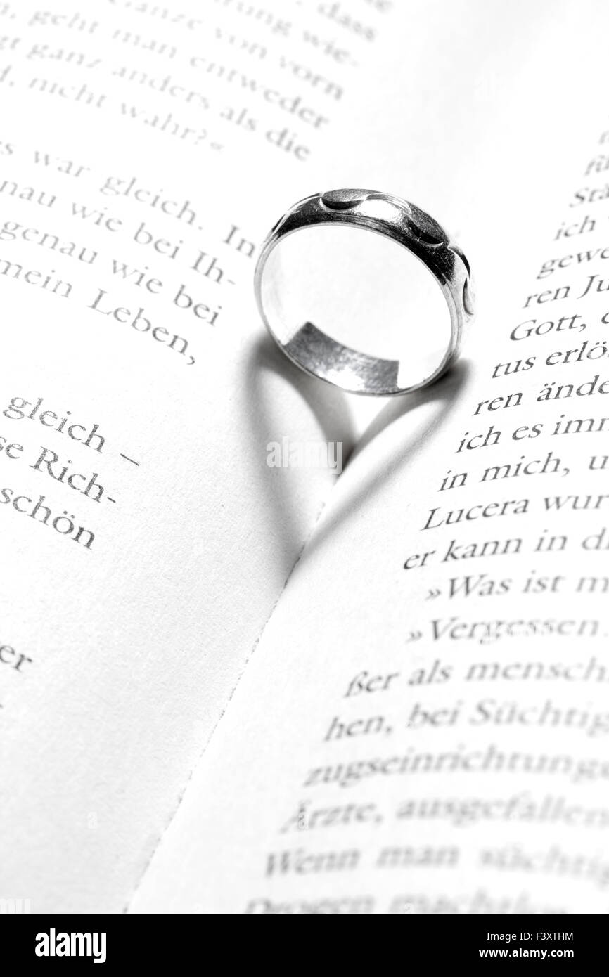heart in a book by a ring Stock Photo