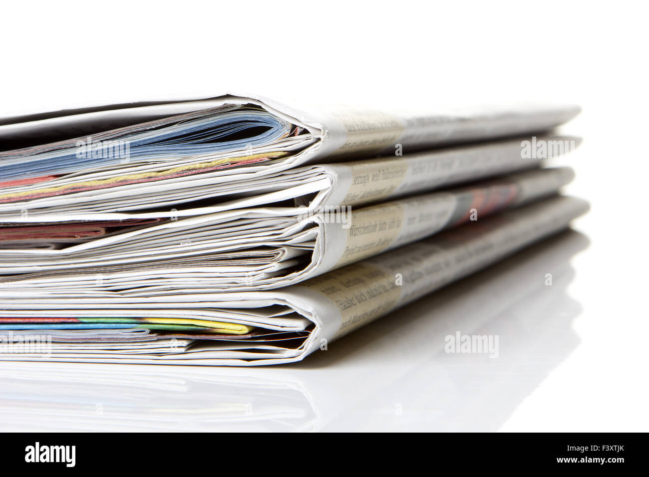 several newspapers, journals stacked Stock Photo