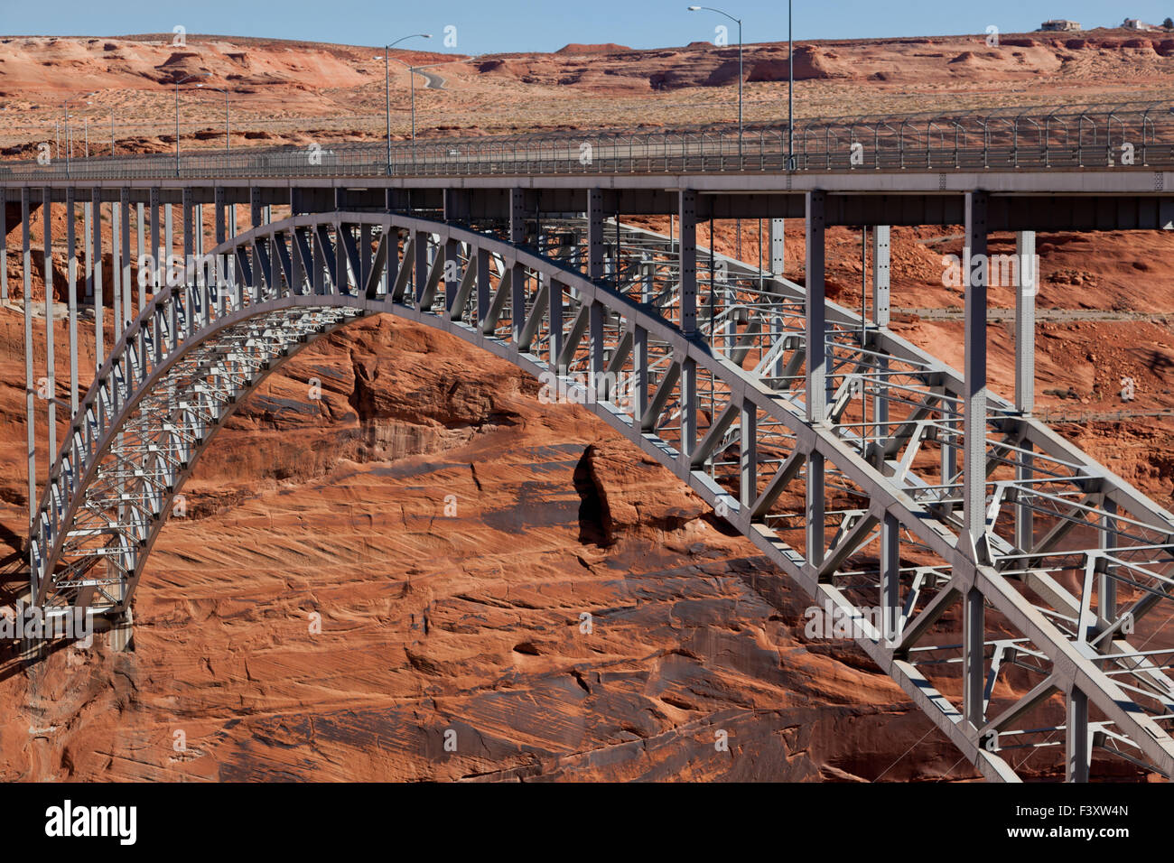 The Glen Canyon Dam Bridge arching across the red rock above the Colorado River in Page, Arizona. Stock Photo