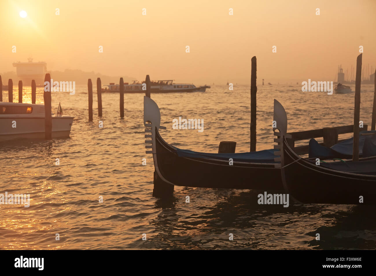 Venetian gondolas at sunrise in Venice Stock Photo - Alamy
