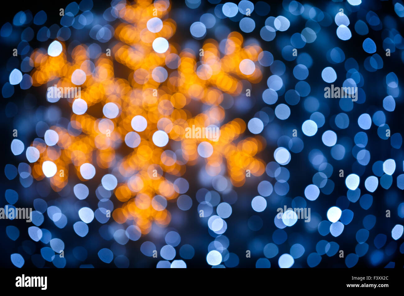 Blurred snowflake and lights background Stock Photo - Alamy