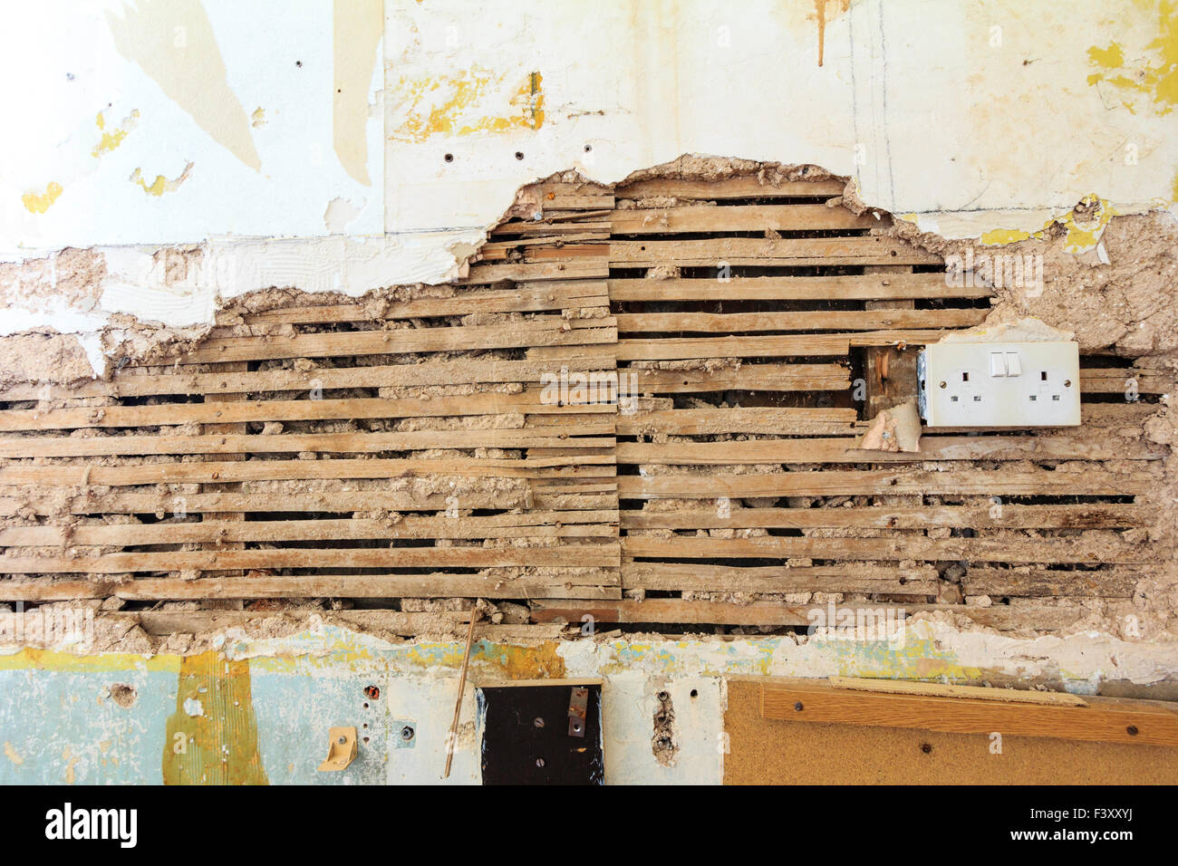 Interior wall of British Victorian House. Broken lath and plaster area