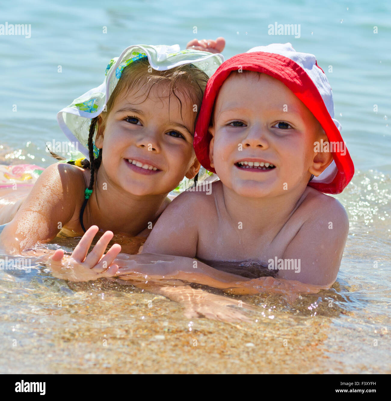 Cute young kids at the sea Stock Photo