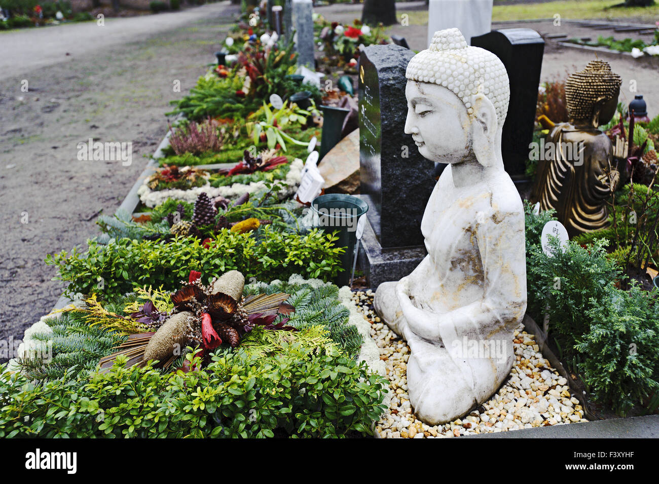 Buddha Statue on grave, Berlin, Germany Stock Photo