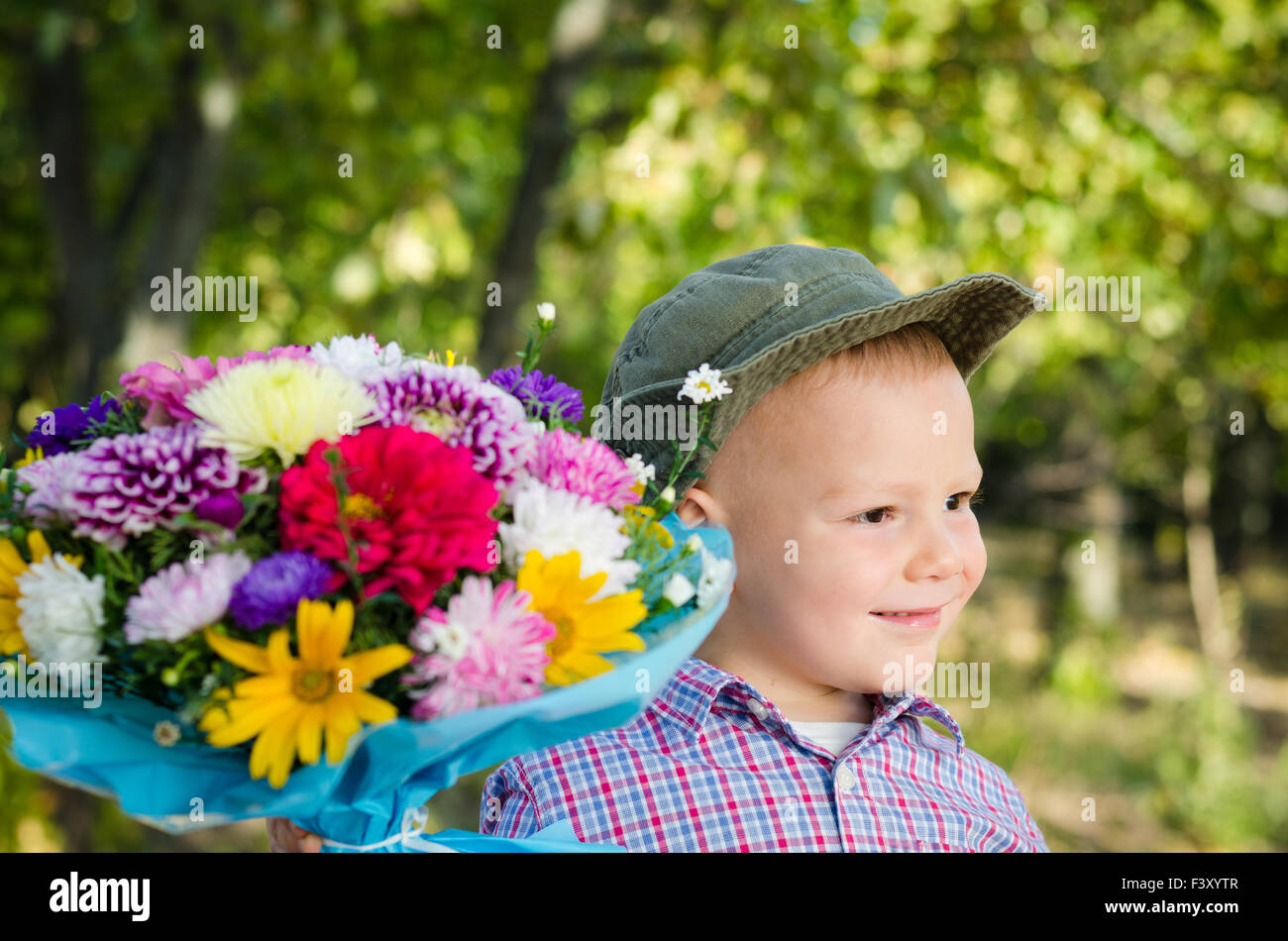 Little boy with flowers for a loved one Stock Photo Alamy