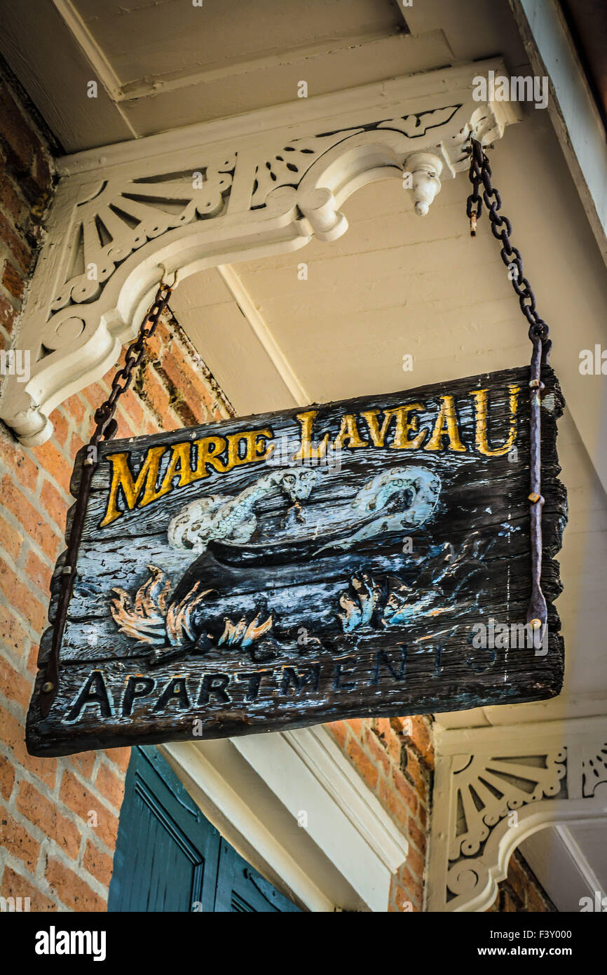 Overhead sign for the Marie Laveau Apartments, named for the legendary Voodoo High Priestess in the French Quarter, New Orleans Stock Photo