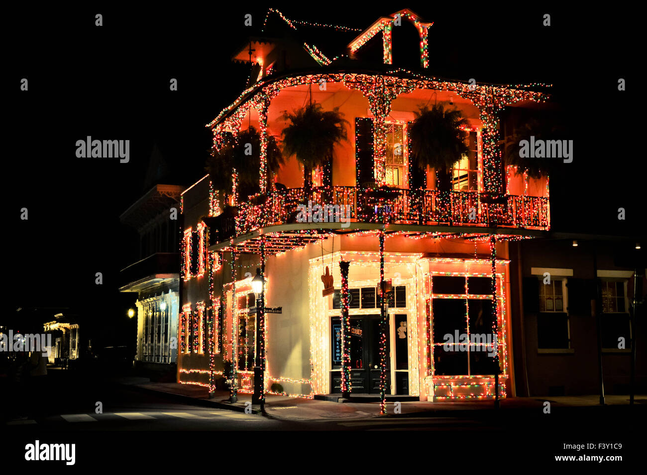 Elaborate Christmas light decorations highlight a classic French