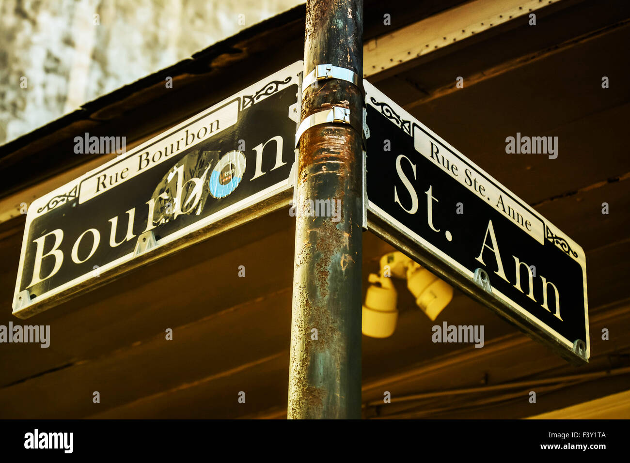 Abused Street sign on the corner of Bourbon and St. Ann in the French Quarter of New Orleans, LA Stock Photo