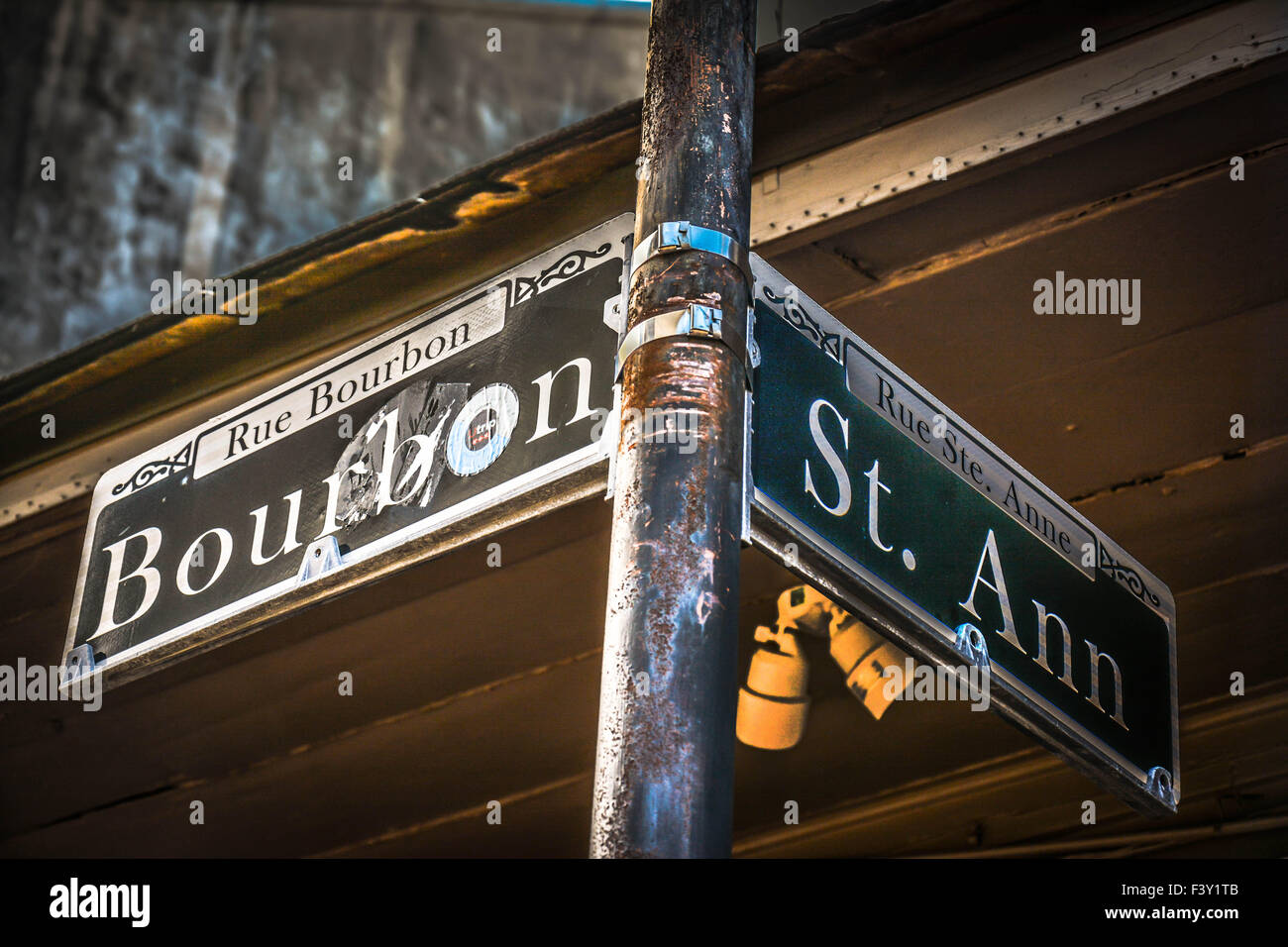 Abused Street sign on the corner of Bourbon and St. Ann in the French Quarter of New Orleans, LA Stock Photo
