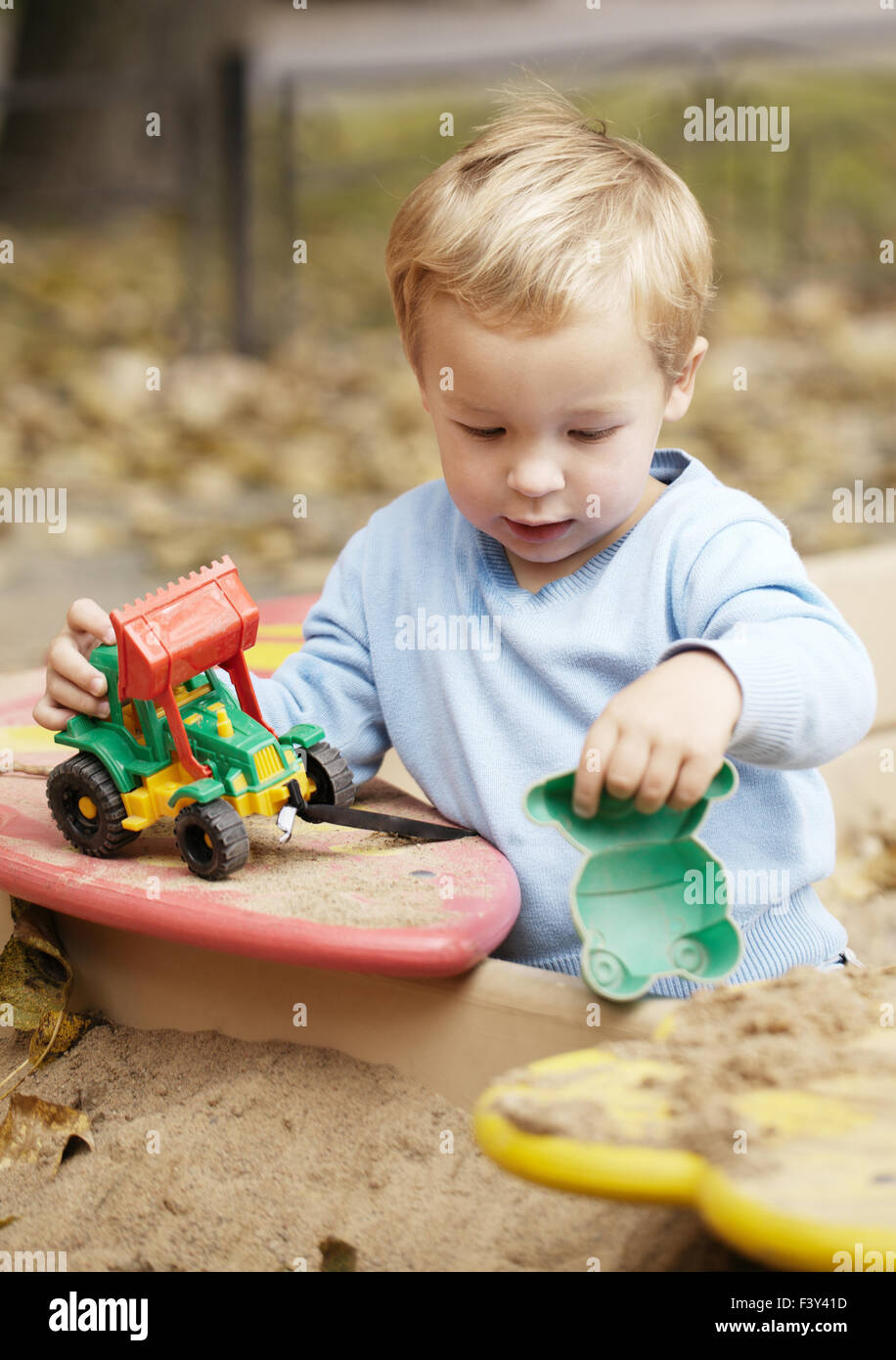 Boy playing with toy outdoor Stock Photo Alamy