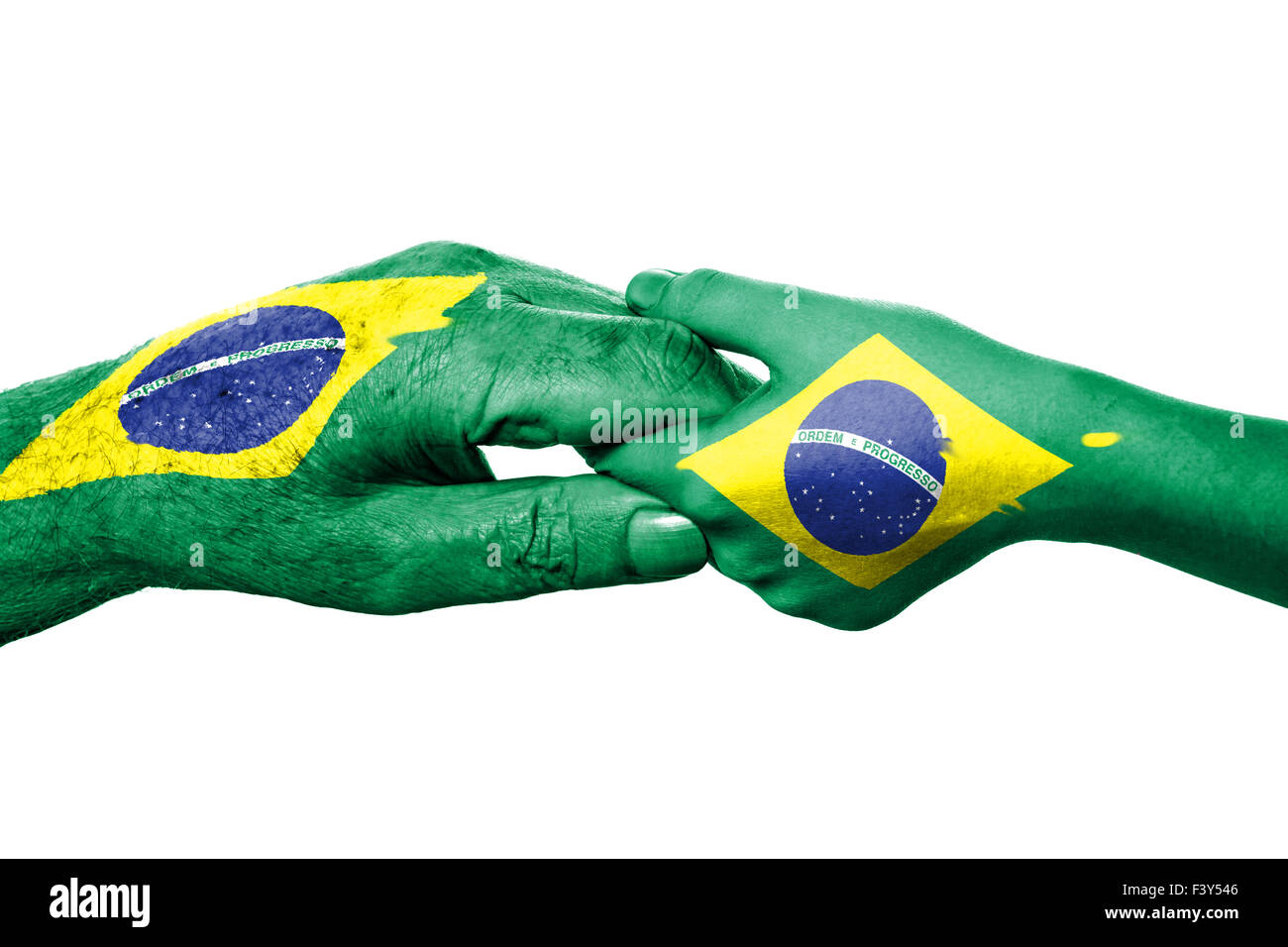 Two hands and Brazilian flag Stock Photo